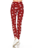 White snowflakes over plaid leggings