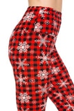 White snowflakes over plaid leggings