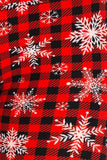 White snowflakes over plaid leggings