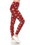White snowflakes over plaid leggings
